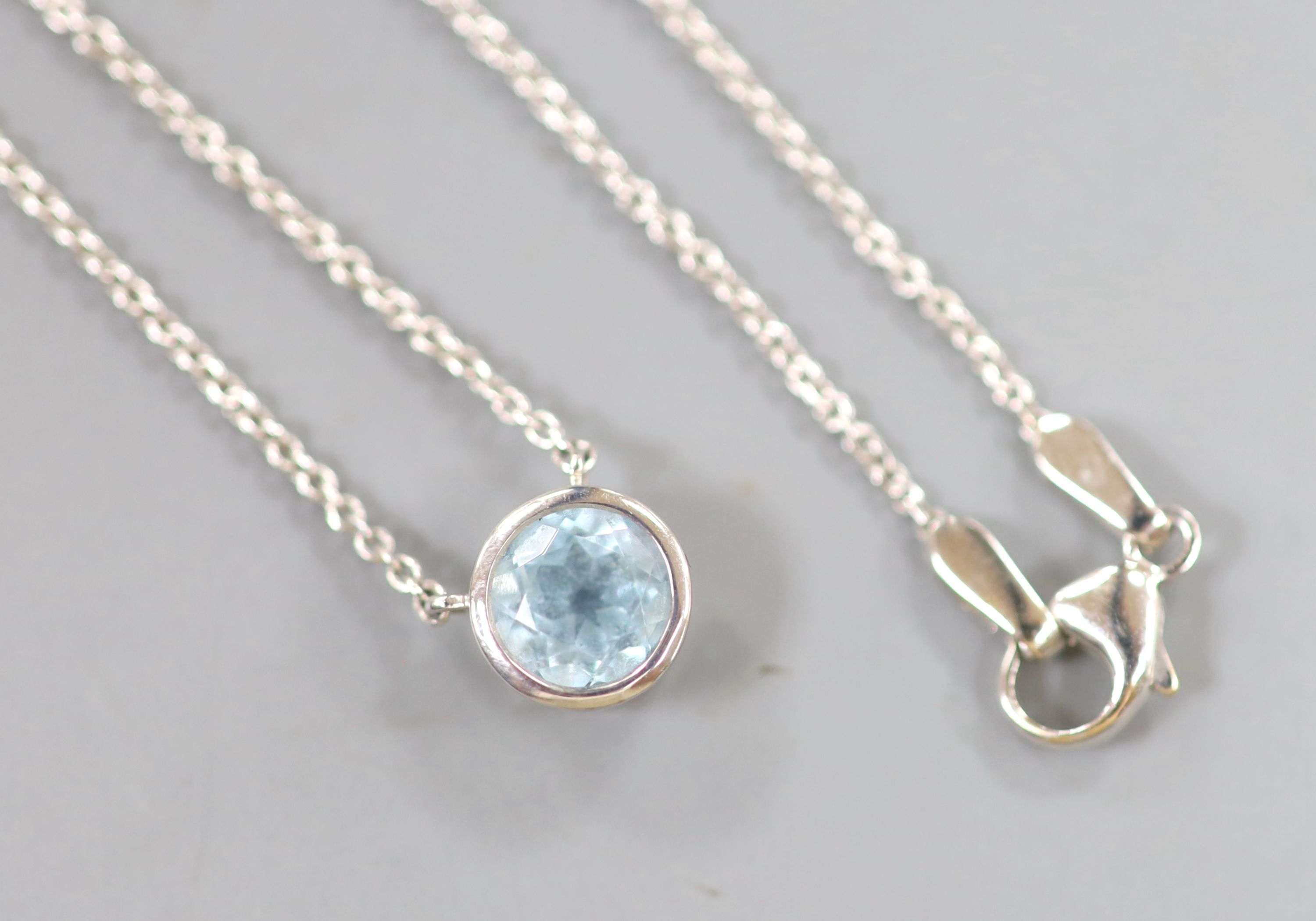 A modern Theo Fennell 18ct white gold and solitaire blue topaz set pendant necklace